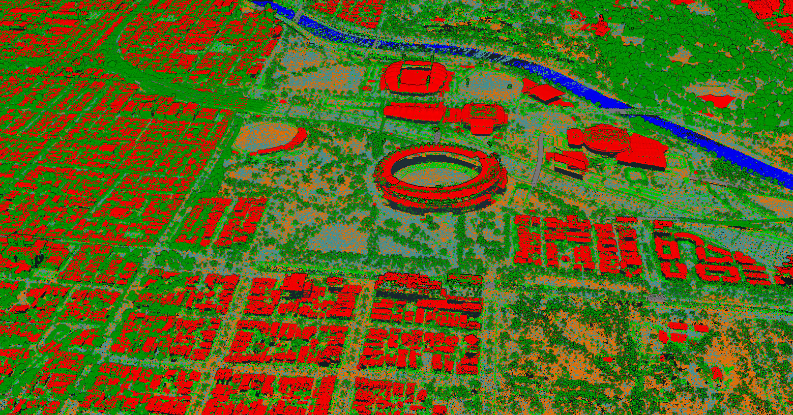 An aerial LiDAR capture over greater Melbourne looking diagonally down across East Melbourne, Fitzroy Gardens, MCG and the Yarra River. Water is shaded in blue, built structures in red, ground surfaces in oranges and greys, and plant growth in green.