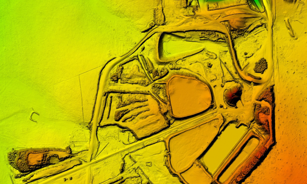 An aerial view Digital Elevation Model over Axedale, showing the heights of structures, tree coverage and ground surface using colours. The highest points are shaded in red, through yellow, greens and blues for the lowest points.