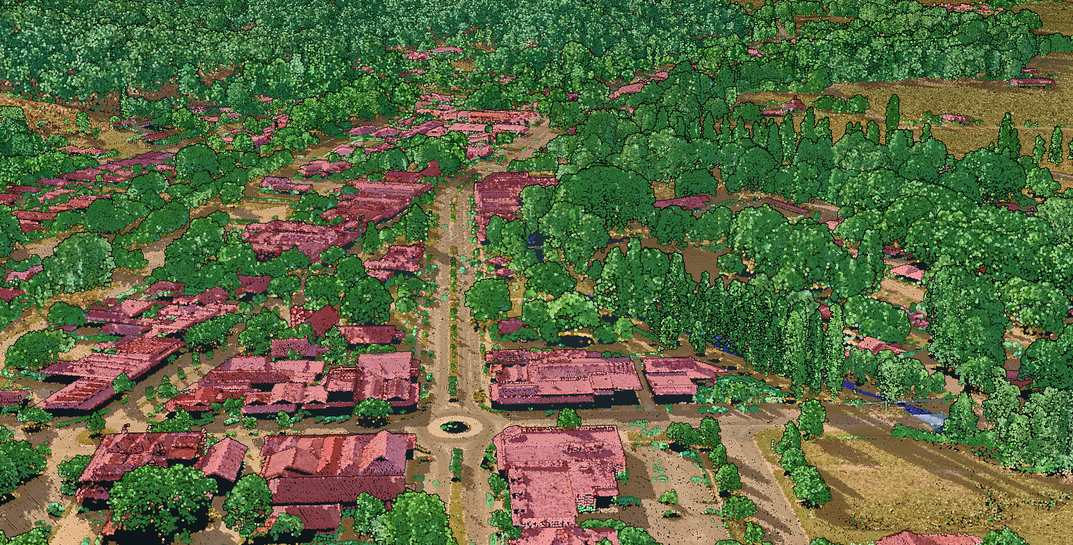 A LiDAR composite image showing a view of Myrtleford from a view looking diagonally down towards the town. Man-made structures are shown in shades of red, topohraphy is depicted in shades of yellow, and natural features in shades of green. There are several roads all vanishing into the mid-ground, with houses along the streets and a roundabout closer to the foreground.