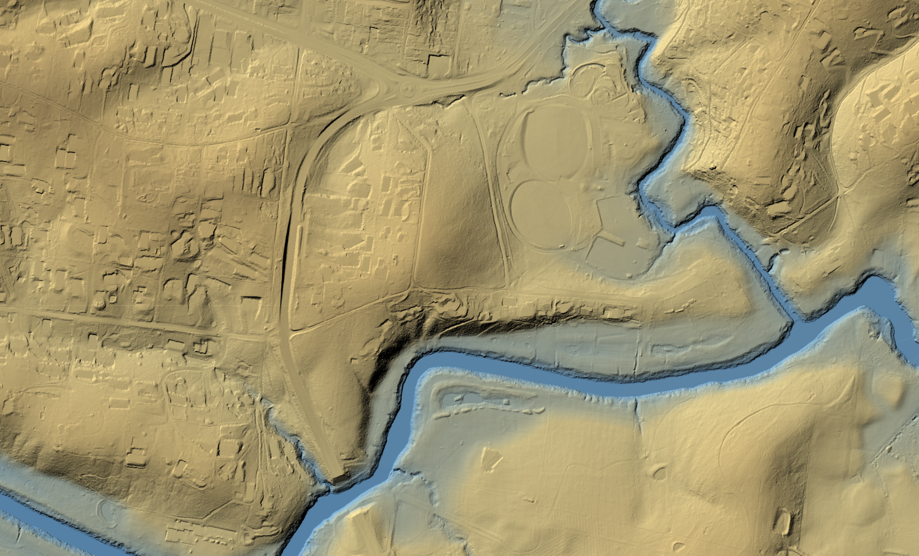 A LiDAR 1m representation of bare earth Melbourne, with shading and colour and shading used to show the contours of the landscape. Waterways are shaded in blue and the ground in earthy tones.